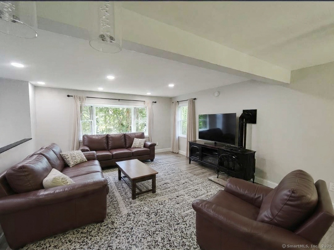 27 Paper Mill Road New Milford, CT 06776 - Photo 5 of 20 a living room with furniture and a flat screen tv