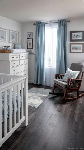a bedroom with furniture and window