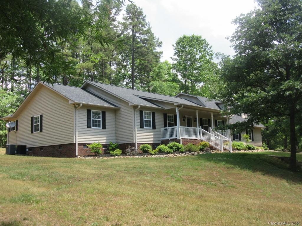 575 Russell Farm Road Kannapolis, NC 28081 - Photo 1 of 23 a front view of house with yard and trees in the background