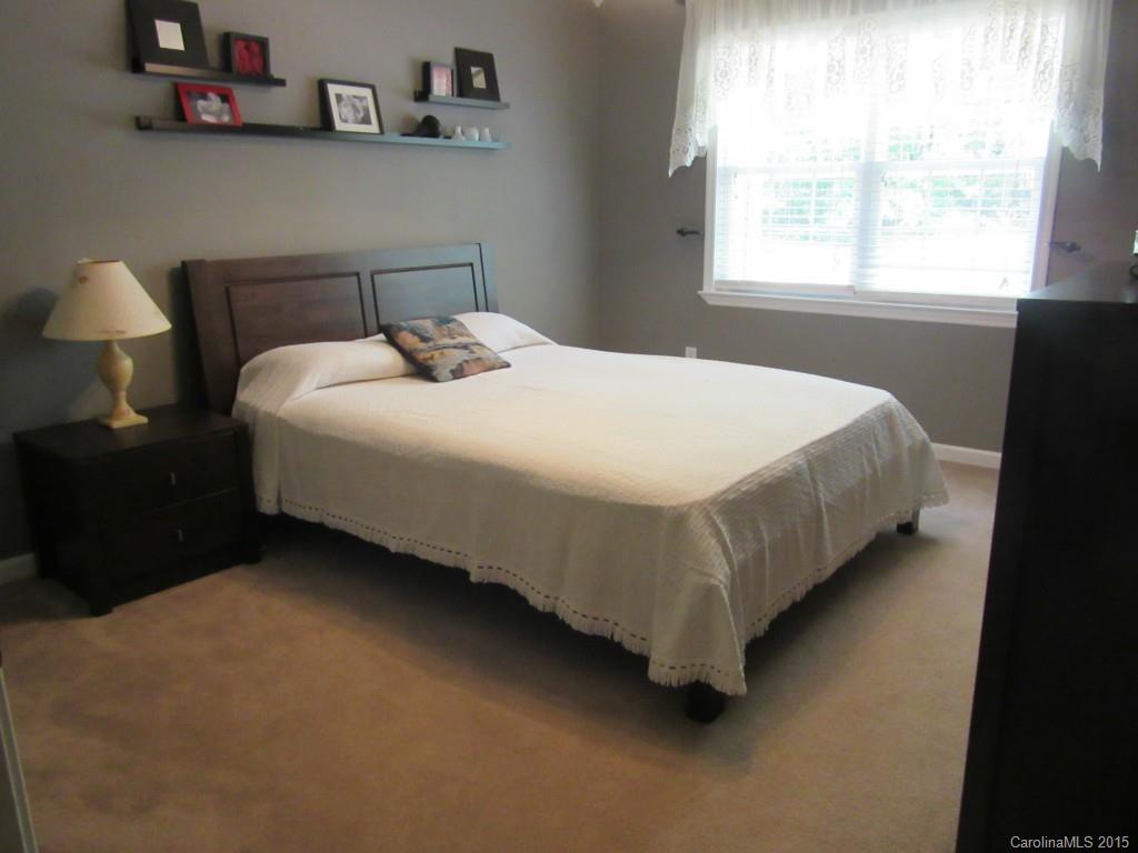 575 Russell Farm Road Kannapolis, NC 28081 - Photo 15 of 23 a bed sitting in a bedroom next to a window