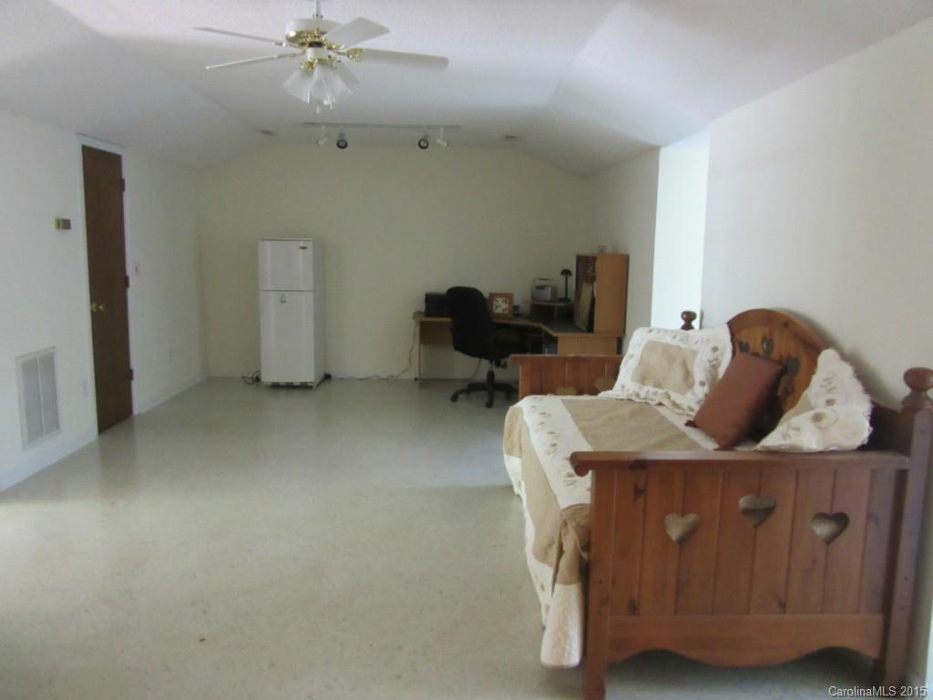 575 Russell Farm Road Kannapolis, NC 28081 - Photo 18 of 23 a living room with furniture and a chandelier
