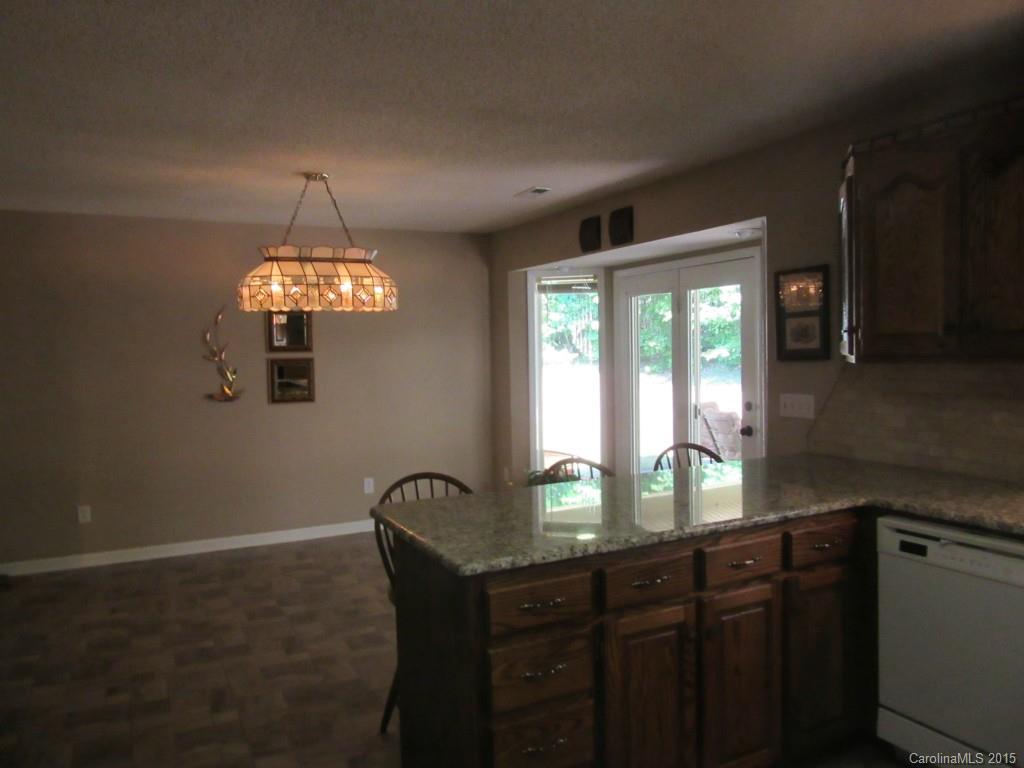 575 Russell Farm Road Kannapolis, NC 28081 - Photo 23 of 23 a view of a dining room with furniture a chandelier and window