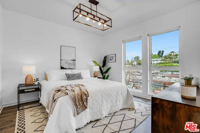 a bedroom with a bed and window