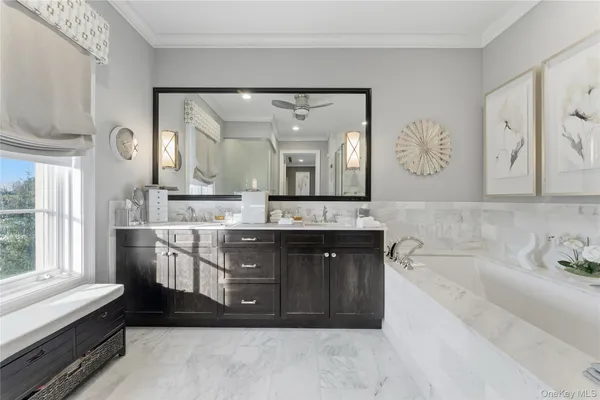 a bathroom with a double vanity sink mirror and double