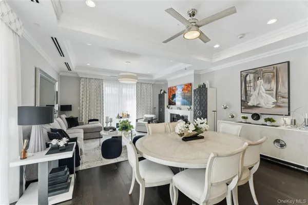 a large kitchen with lots of counter space a sink appliances and living room view