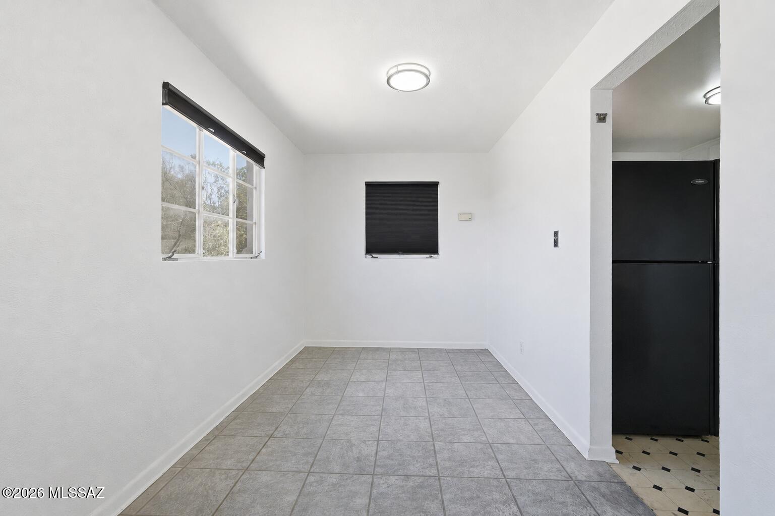 2721 East Fort Lowell Road Tucson, AZ 85716 - Photo 8 of 28 a view of an empty room with a window