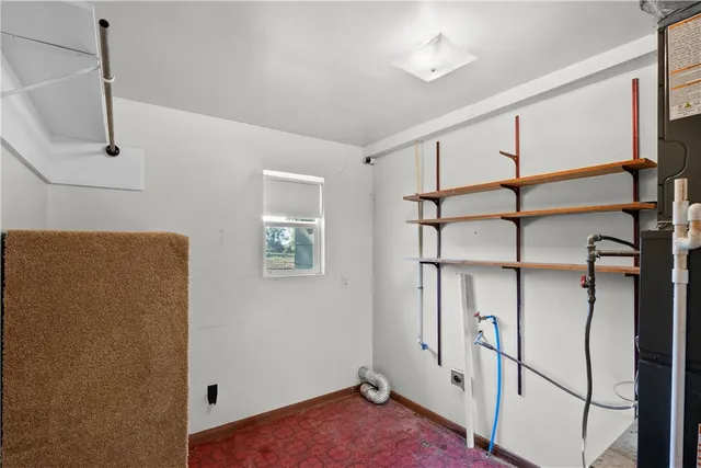 a view of an empty room with stairs