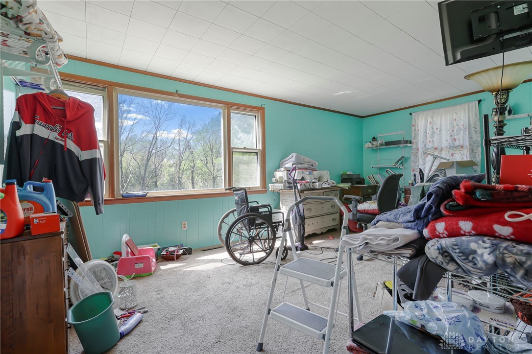2390 Ridge Road Zanesville, OH 43701 - Photo 23 of 45 This versatile room offers abundant natural light and ample space for various uses.
