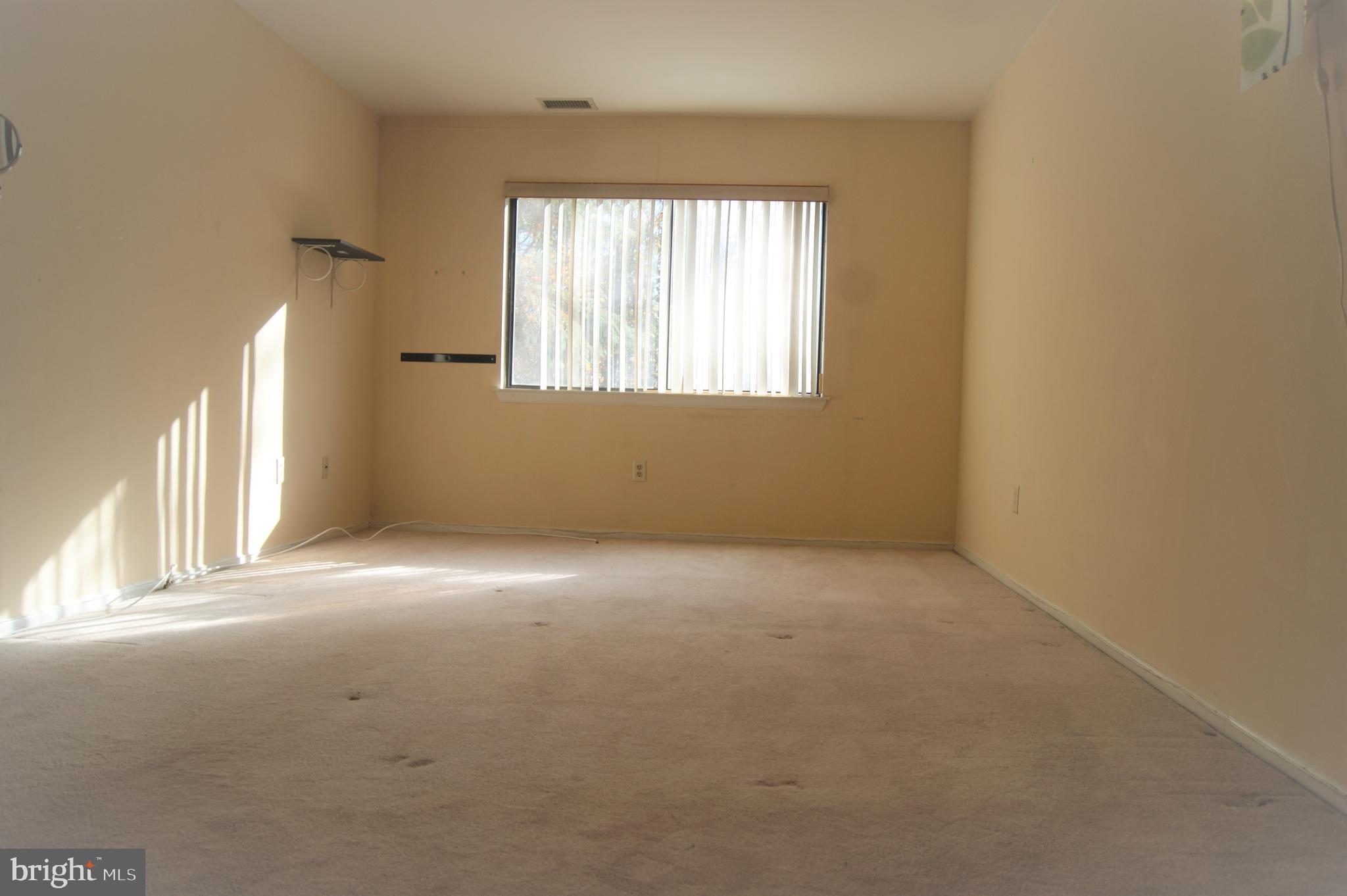 2901 Fallstaff Road, Unit 205 Baltimore, MD 21209 - Photo 13 of 24 an empty room with a window