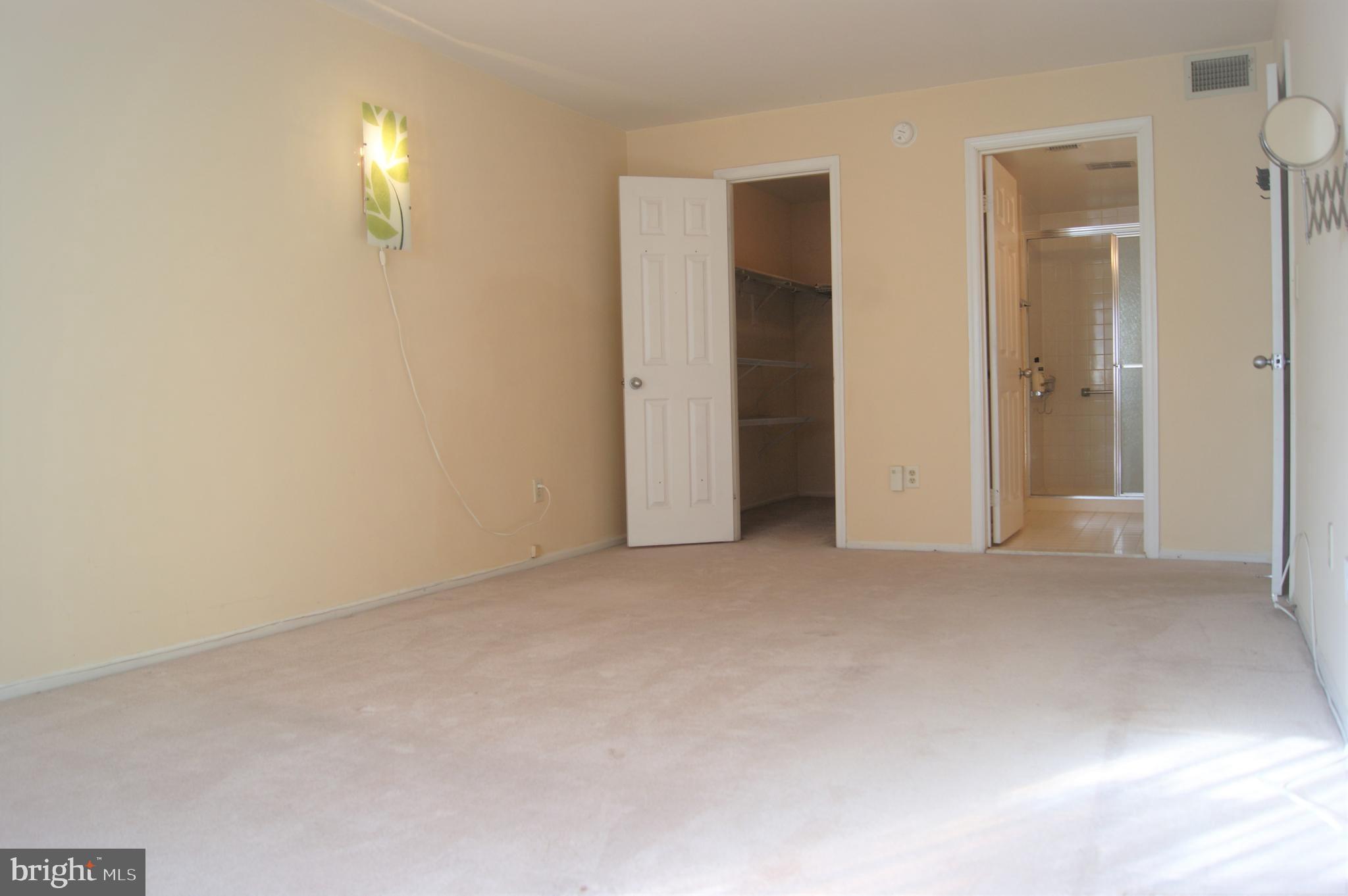 2901 Fallstaff Road, Unit 205 Baltimore, MD 21209 - Photo 14 of 24 an empty room with windows and closet