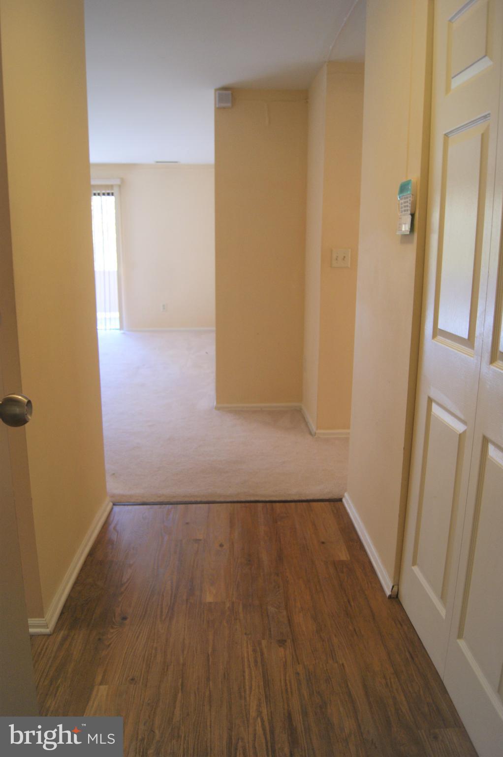 2901 Fallstaff Road, Unit 205 Baltimore, MD 21209 - Photo 4 of 24 an empty room with wooden floor