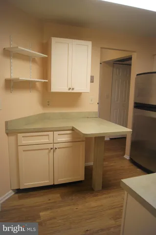 a kitchen with stainless steel appliances granite countertop a stove microwave and sink