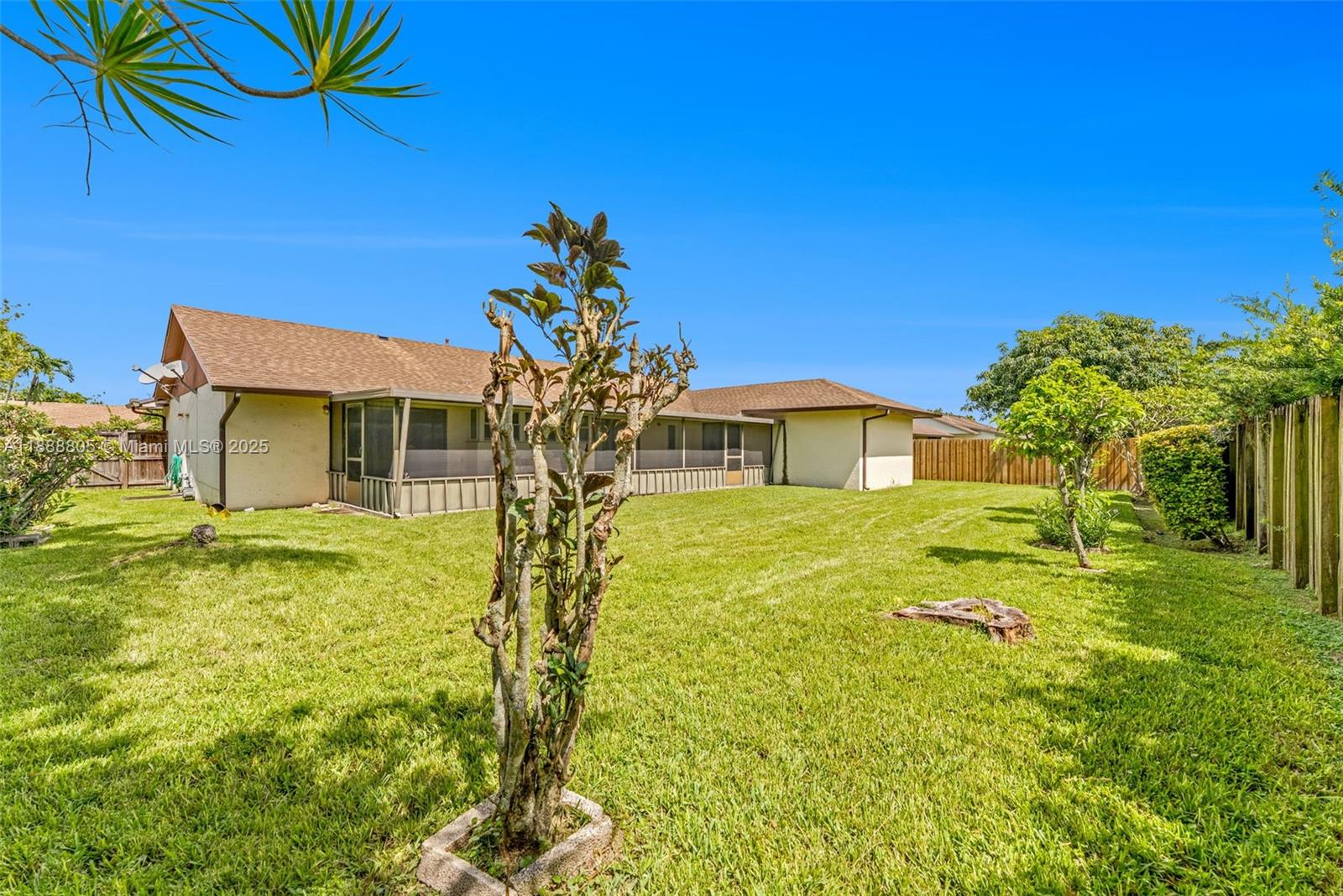 11614 Southwest 101st Terrace Miami, FL 33176 - Photo 15 of 17 a front view of a house with a yard