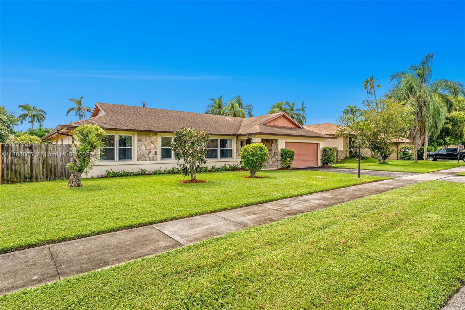 11614 Southwest 101st Terrace Miami, FL 33176 - Photo 2 of 17 a front view of a house with a yard