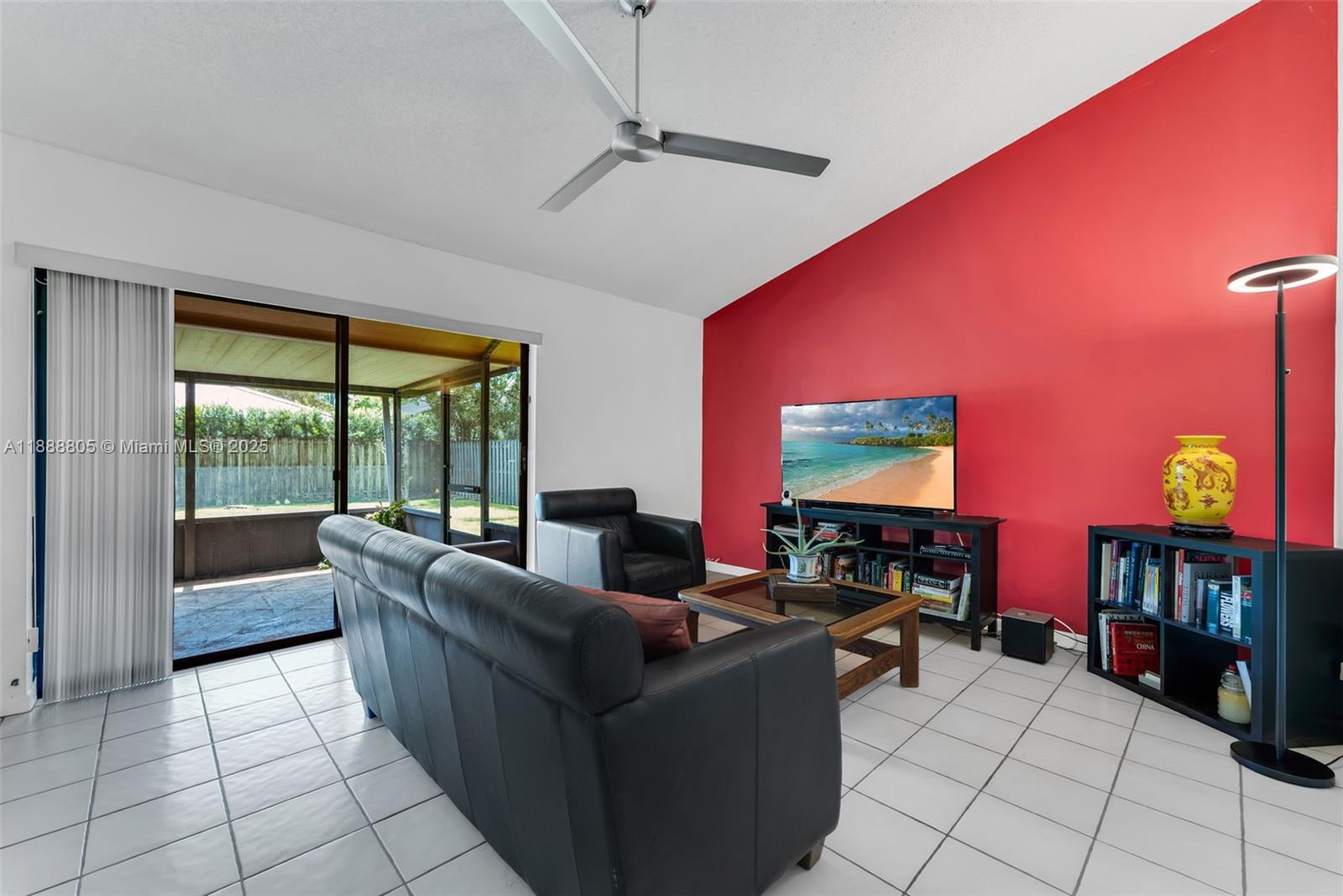 11614 Southwest 101st Terrace Miami, FL 33176 - Photo 3 of 17 a living room with furniture and a flat screen tv