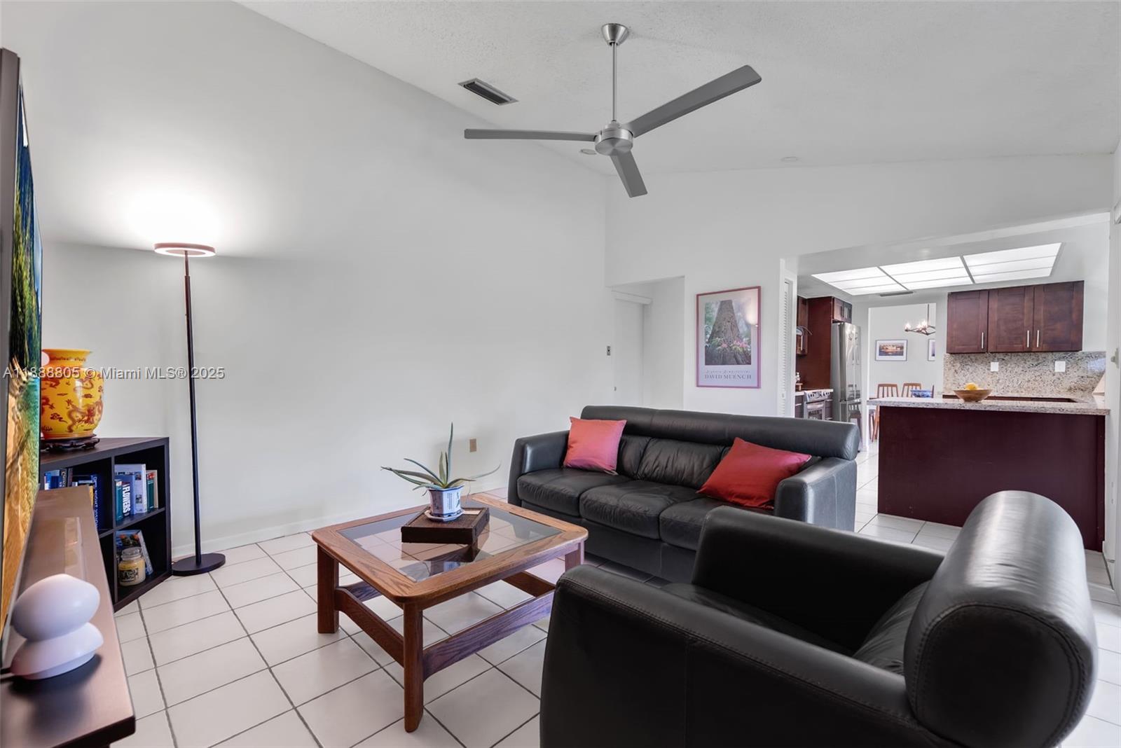 11614 Southwest 101st Terrace Miami, FL 33176 - Photo 4 of 17 a living room with furniture and a wooden floor