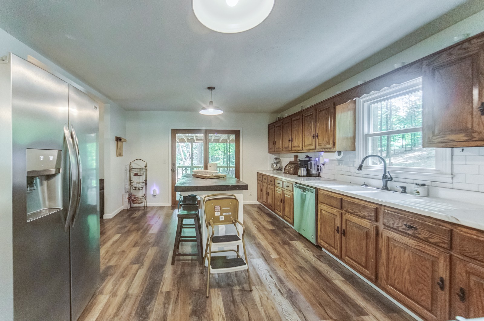 3733 Oakland Road Springfield, TN 37172 - Photo 8 of 43 a kitchen with sink cabinets and wooden floor