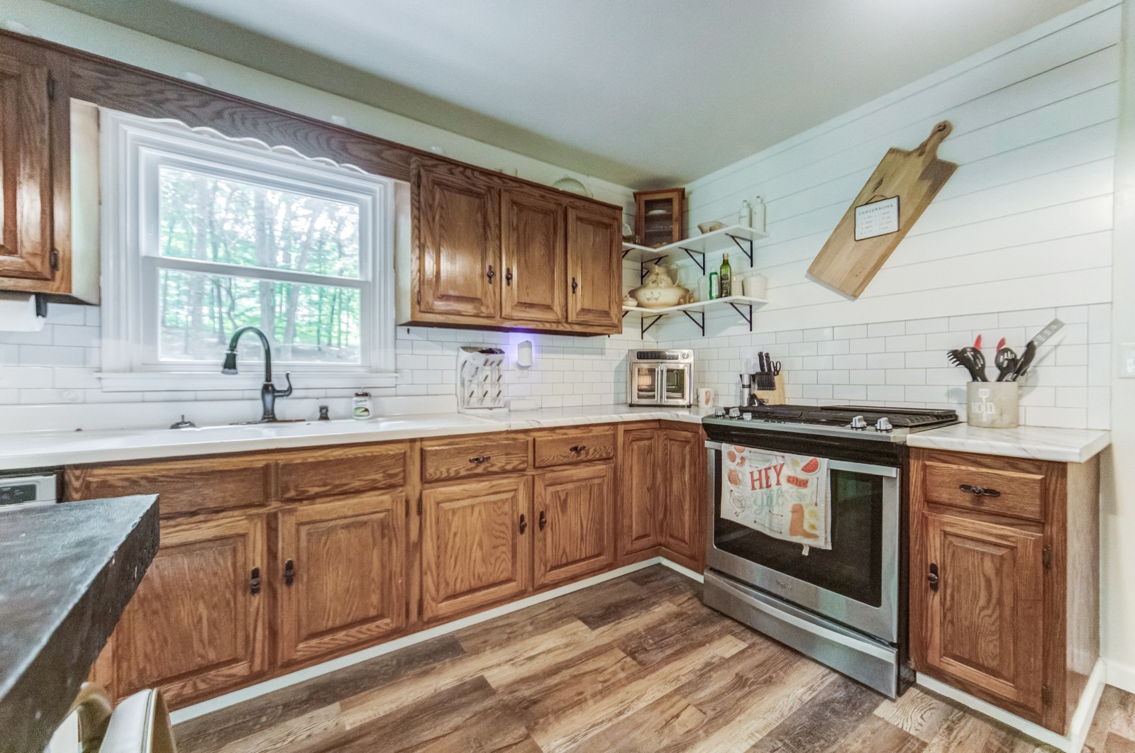 3733 Oakland Road Springfield, TN 37172 - Photo 10 of 43 a kitchen with stainless steel appliances granite countertop a sink stove and cabinets