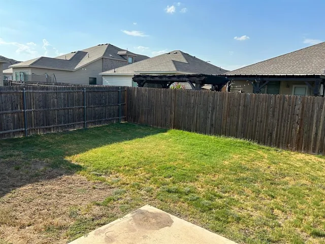 a swimming pool with wooden fence
