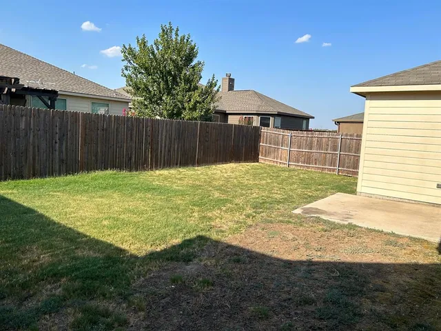 a house with yard in front of it