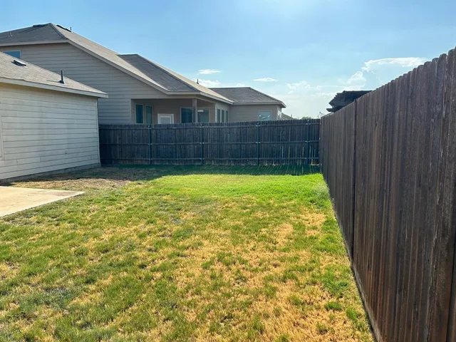 a white toilet sitting next to a shower