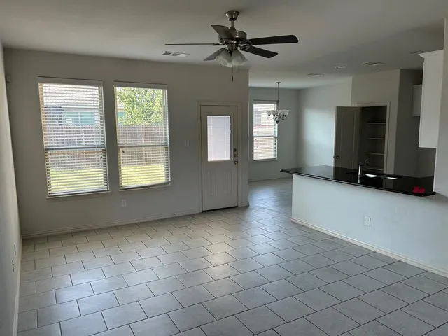 a view of an empty room with a window