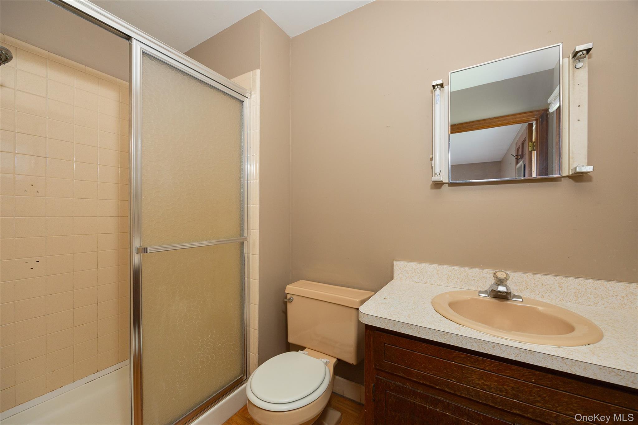 1 Peach Road Poughkeepsie, NY 12601 - Photo 20 of 22 a bathroom with a sink a toilet and mirror