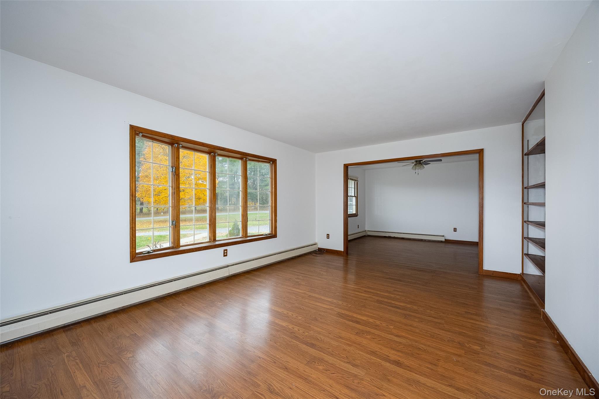 1 Peach Road Poughkeepsie, NY 12601 - Photo 5 of 22 a view of an empty room with wooden floor and a window