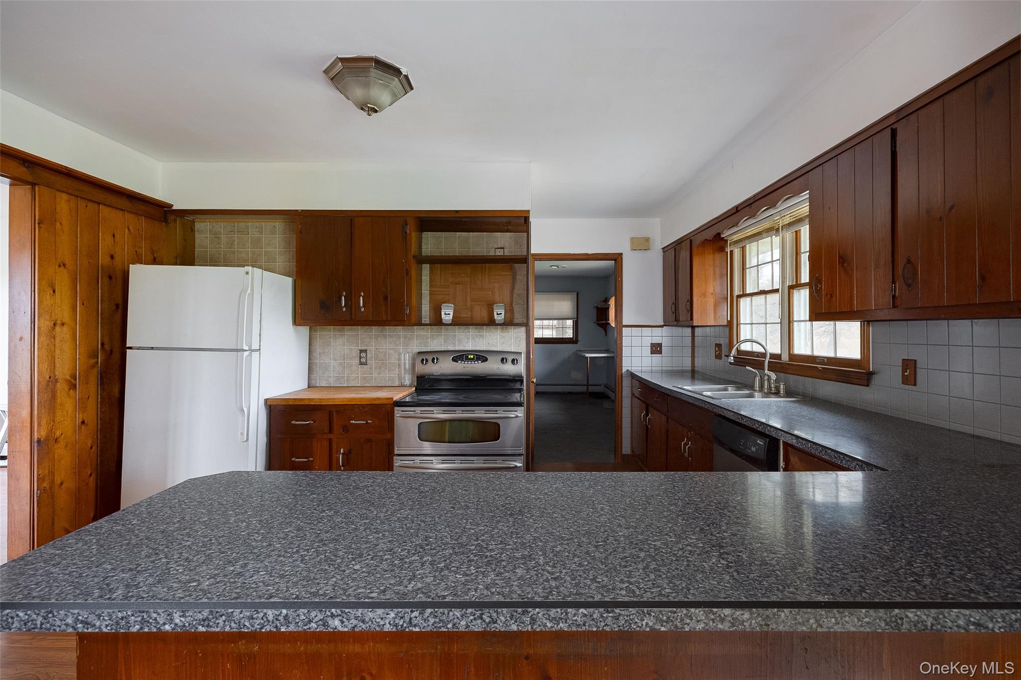 1 Peach Road Poughkeepsie, NY 12601 - Photo 7 of 22 a kitchen with stainless steel appliances granite countertop a refrigerator a stove top oven a sink and dishwasher