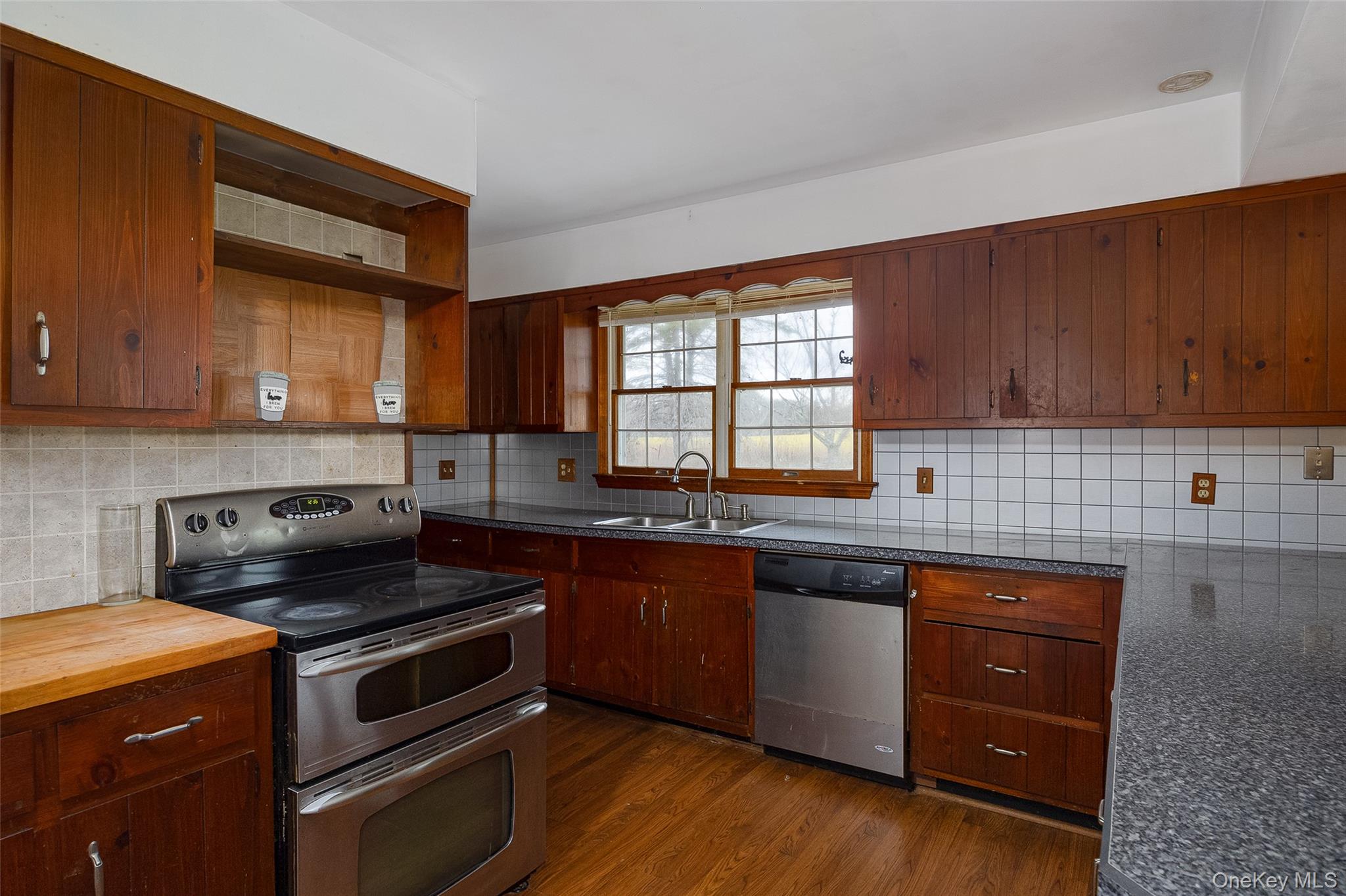 1 Peach Road Poughkeepsie, NY 12601 - Photo 8 of 22 a kitchen with stainless steel appliances granite countertop wooden cabinets and a stove top oven