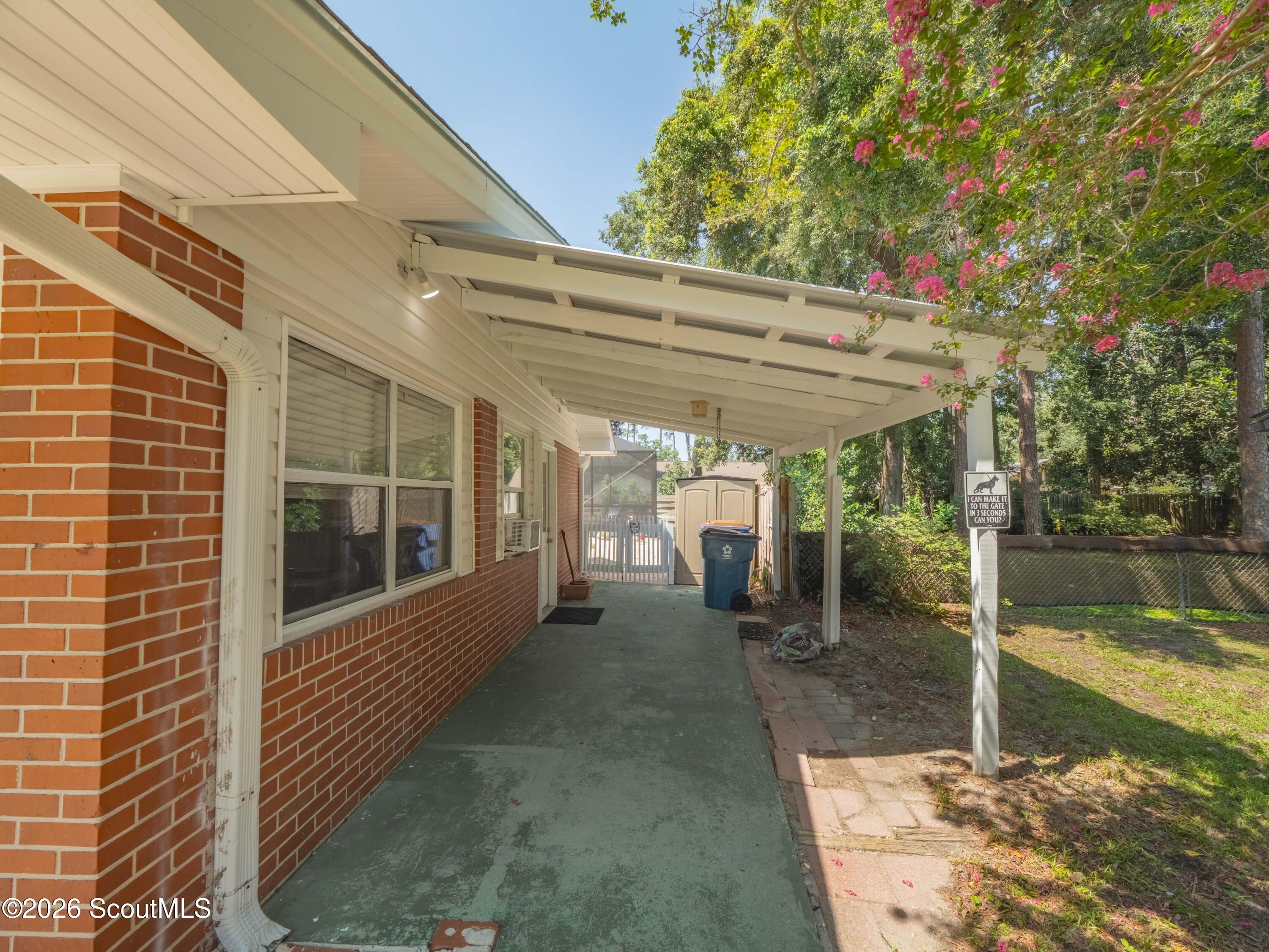 113 Ingham Street St. Simons Island, GA 31522 - Photo 37 of 48 Guest suite entry and carport