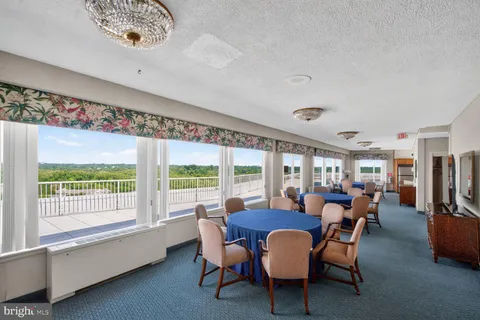 a view of a dining room with furniture window and outside view