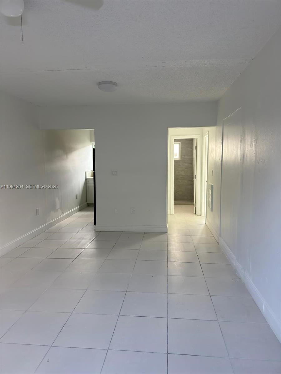 2622 Northwest 24th Street, Unit 1B Miami, FL 33142 - Photo 11 of 16 a view of an empty room