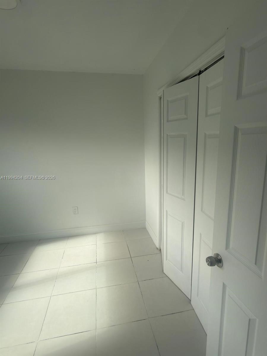2622 Northwest 24th Street, Unit 1B Miami, FL 33142 - Photo 16 of 16 a bathroom with a shower