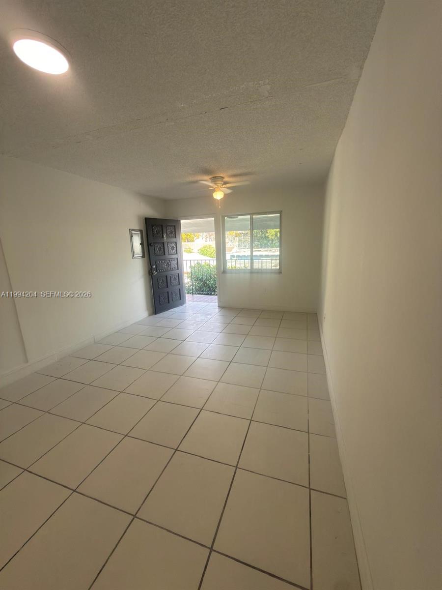 2622 Northwest 24th Street, Unit 1B Miami, FL 33142 - Photo 2 of 16 a view of a livingroom and window