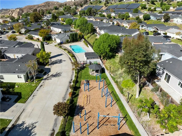an aerial view of residential houses with outdoor space