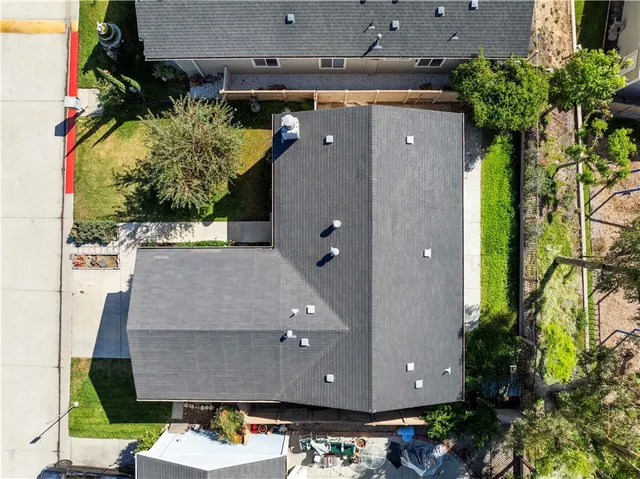 an aerial view of a house with a swimming pool