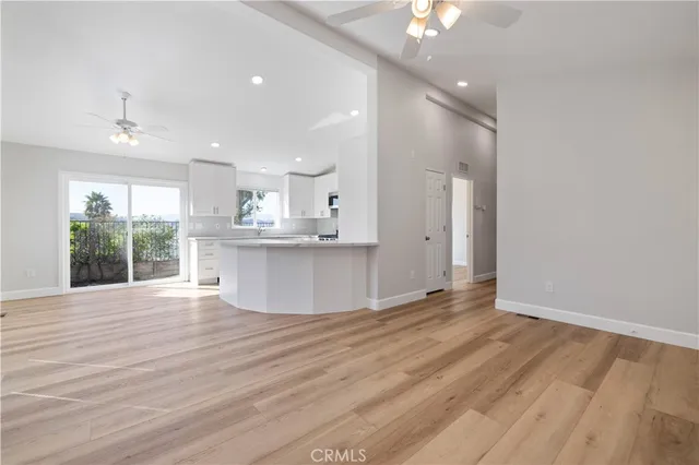 a view of a kitchen with marble kitchen and stainless steel appliances