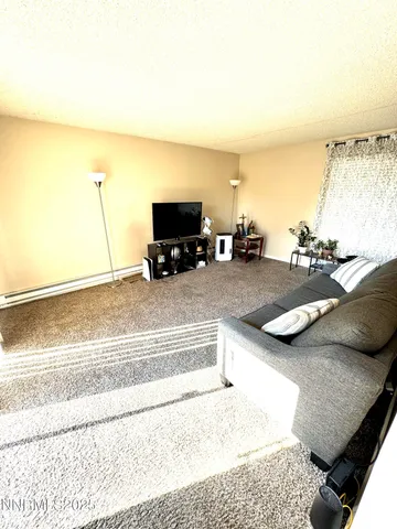 a living room with a couch and a flat screen tv