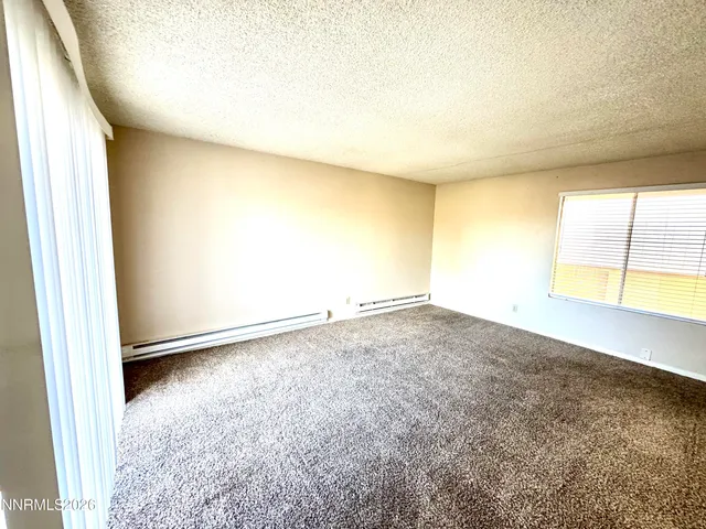 an empty room with a empty space and a window