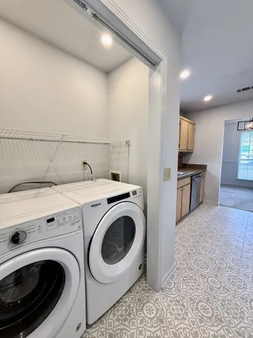 a utility room with dryer and washer