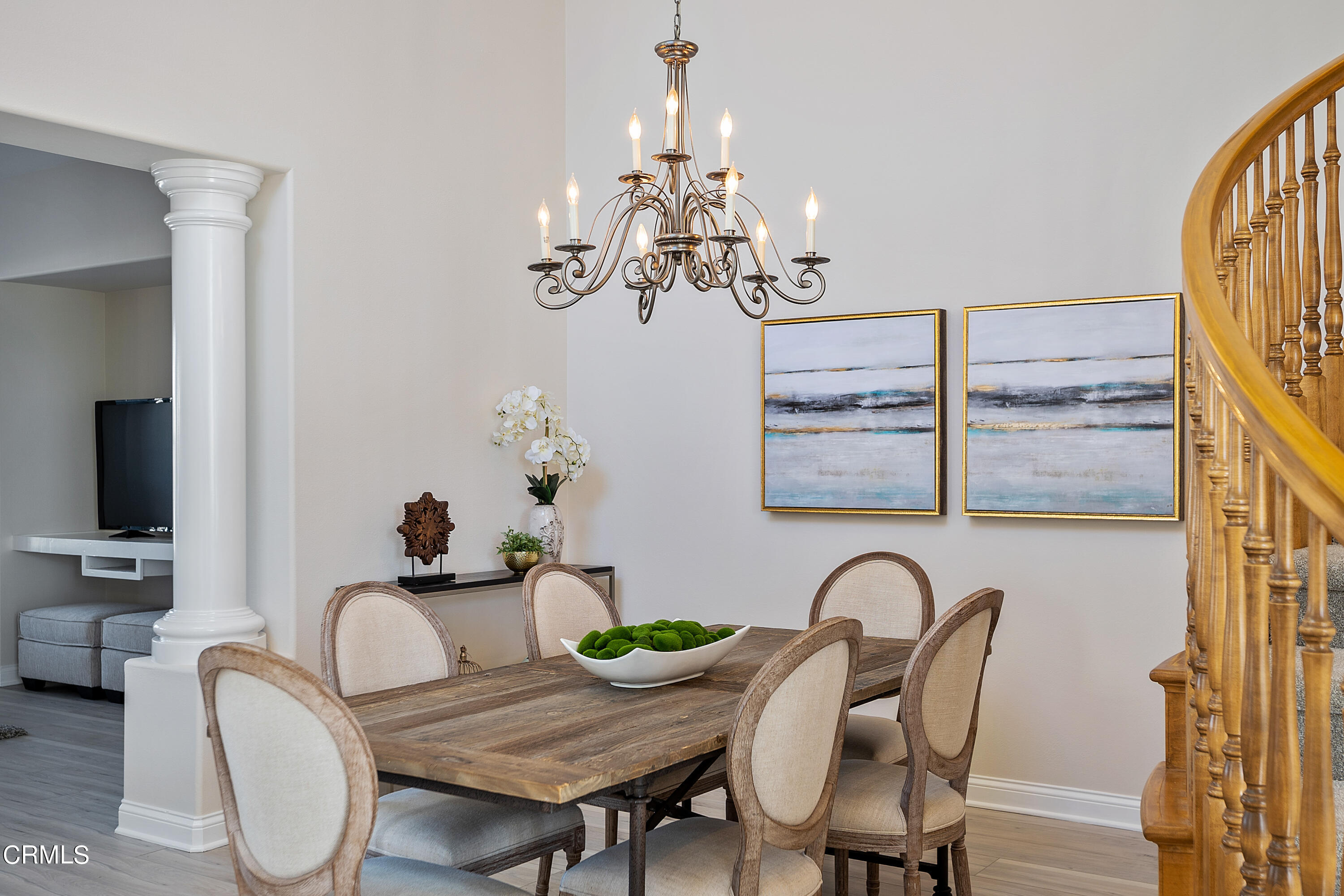 3957 West Hemlock Street Oxnard, CA 93035 - Photo 13 of 46 a view of a dining room with furniture wooden floor and chandelier