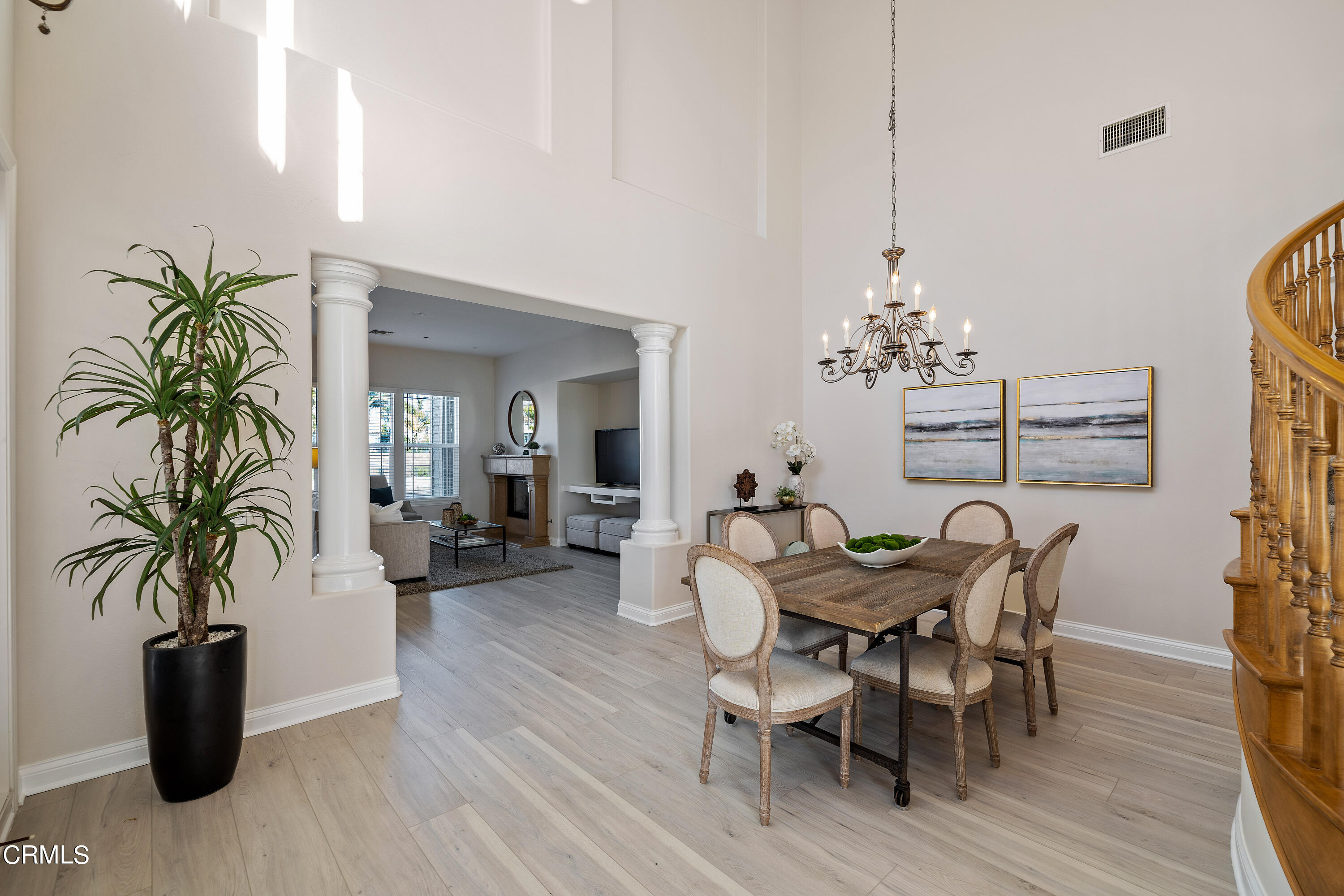 3957 West Hemlock Street Oxnard, CA 93035 - Photo 16 of 46 a view of a dining room with furniture and wooden floor