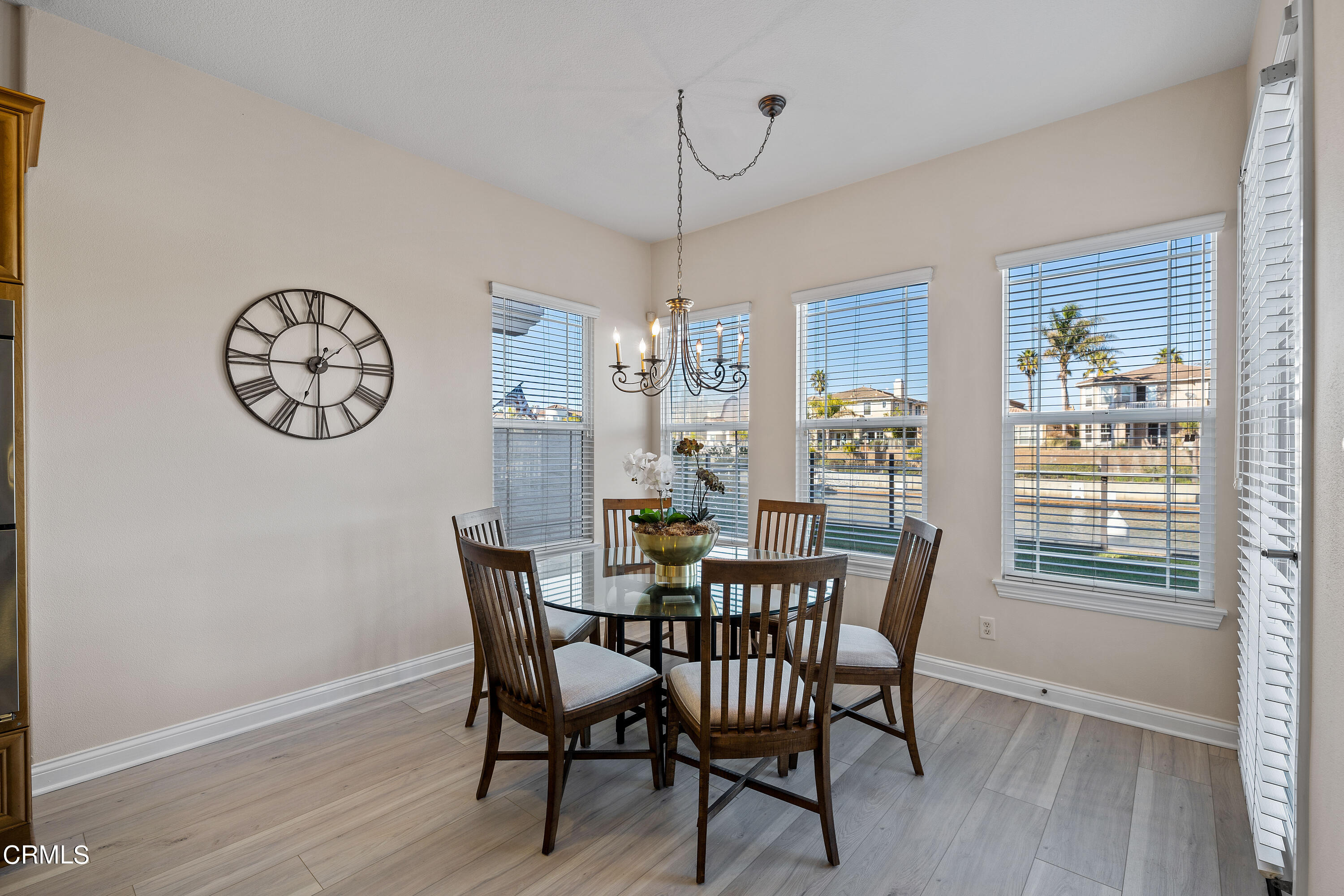 3957 West Hemlock Street Oxnard, CA 93035 - Photo 25 of 46 a view of a dining room with furniture window and wooden floor