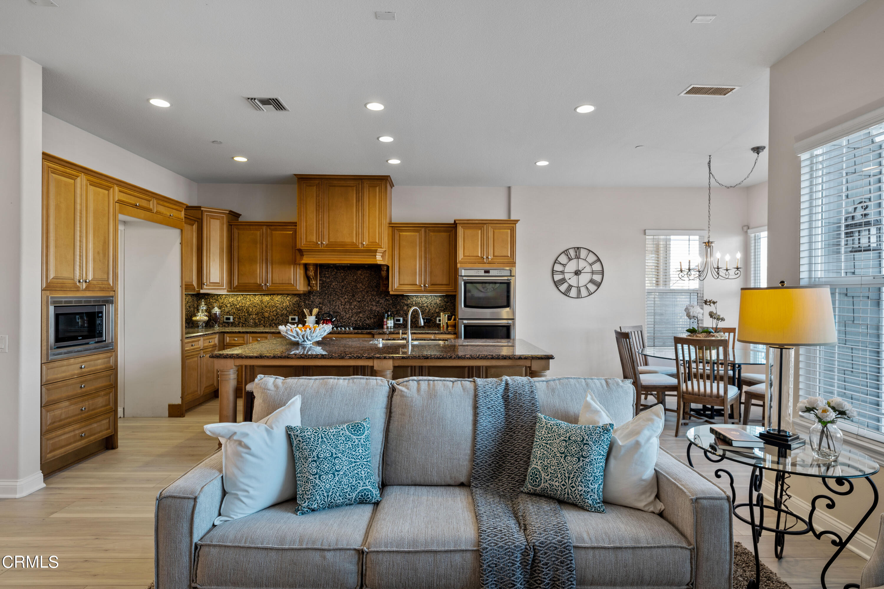 3957 West Hemlock Street Oxnard, CA 93035 - Photo 27 of 46 a view of kitchen with stainless steel appliances granite countertop living room and a couch
