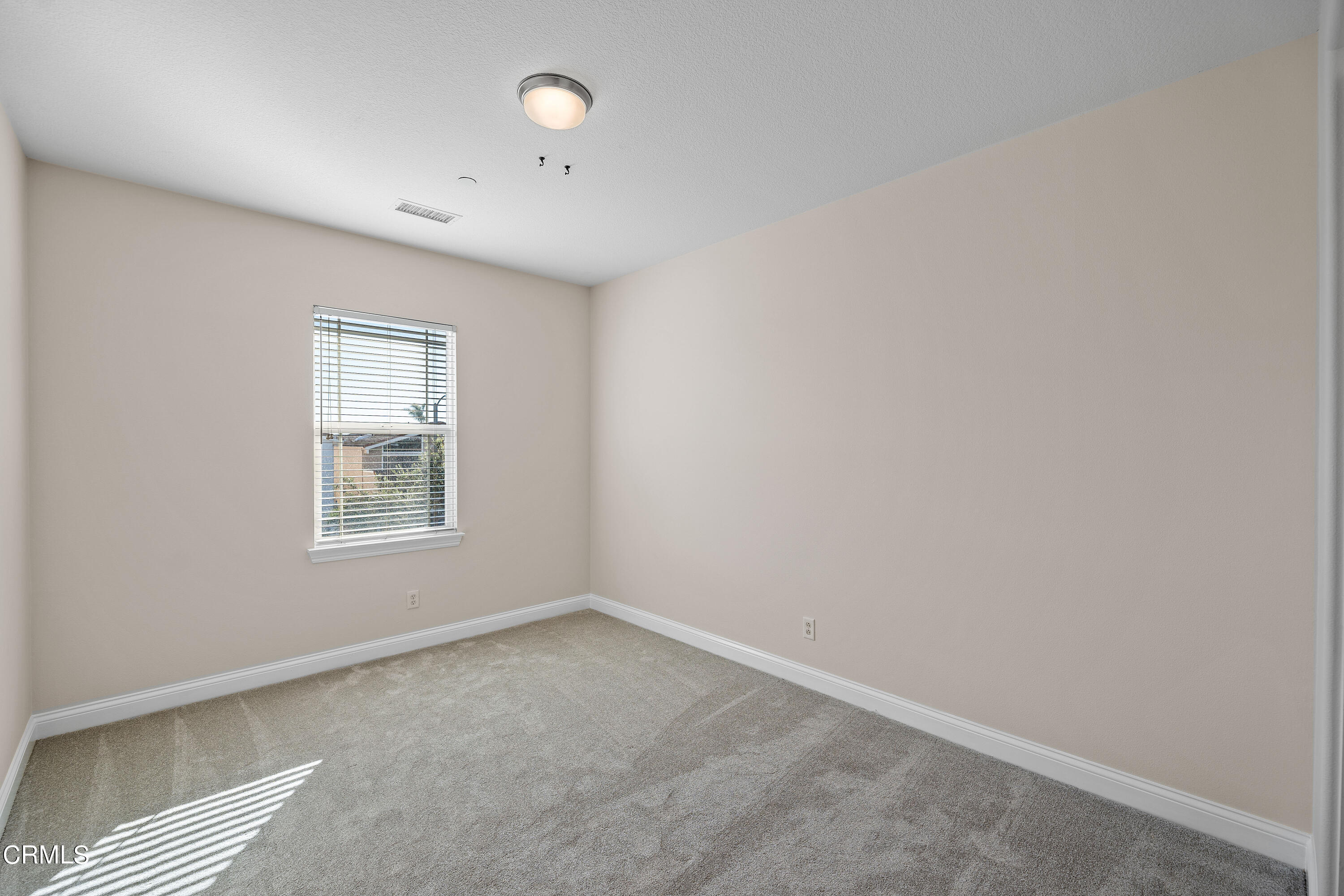 3957 West Hemlock Street Oxnard, CA 93035 - Photo 32 of 46 an empty room with a window