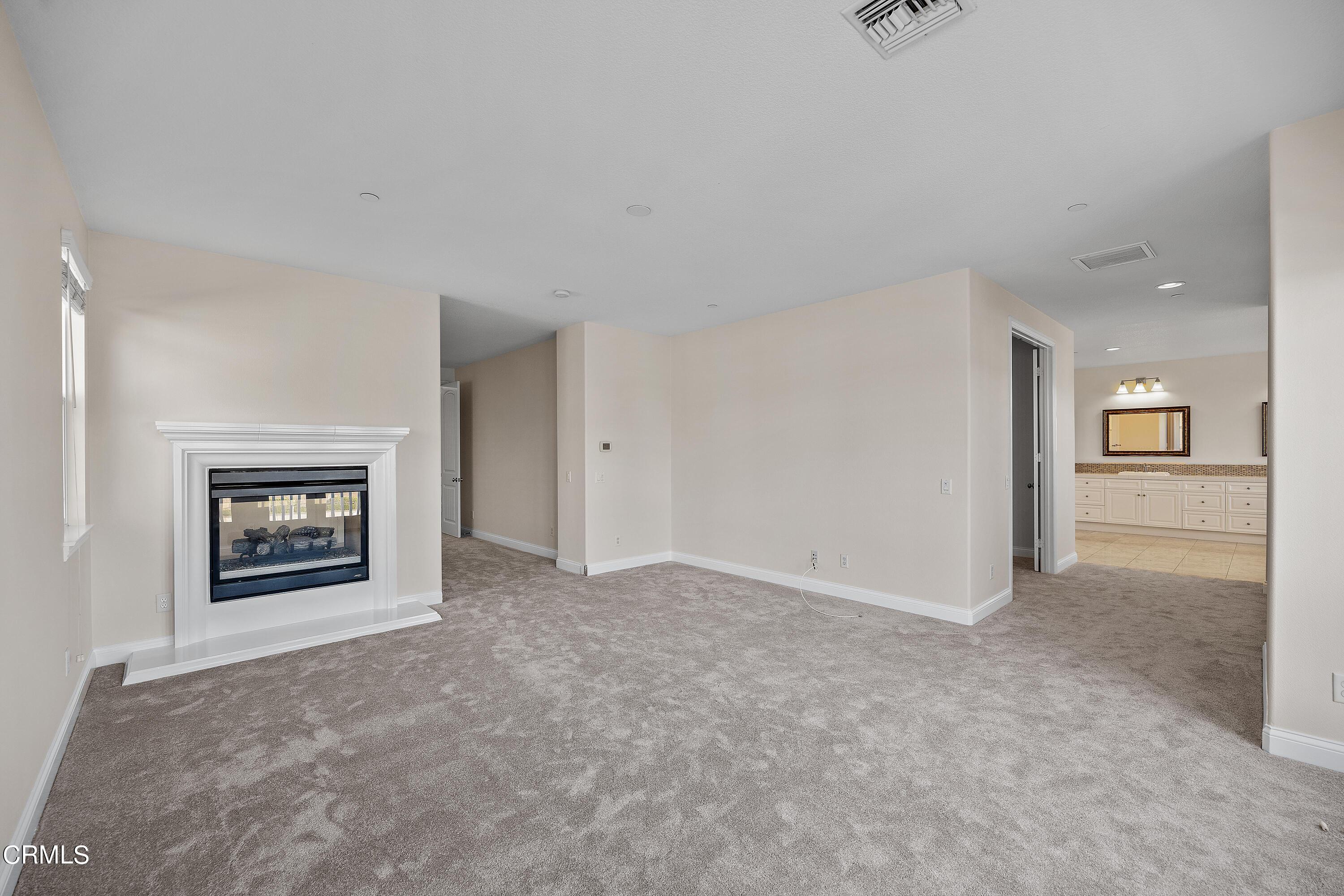 3957 West Hemlock Street Oxnard, CA 93035 - Photo 37 of 46 an empty room with a view of a hallway
