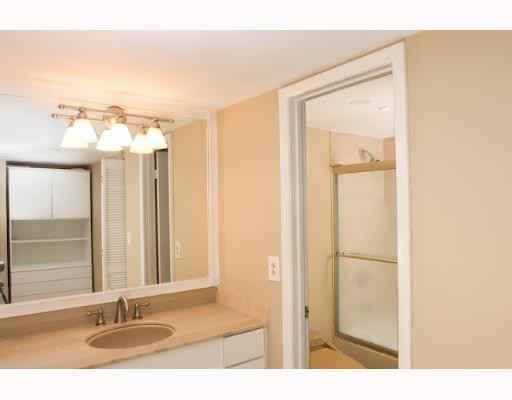 9273 Collins Avenue, Unit 1109 Surfside, FL 33154 - Photo 6 of 8 a bathroom with a sink and a mirror