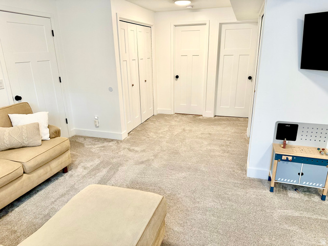 7818 North Windhover Road Eagle Mountain, UT 84005 - Photo 24 of 32 Neutral carpet flooring throughout a room featuring white walls and white trim