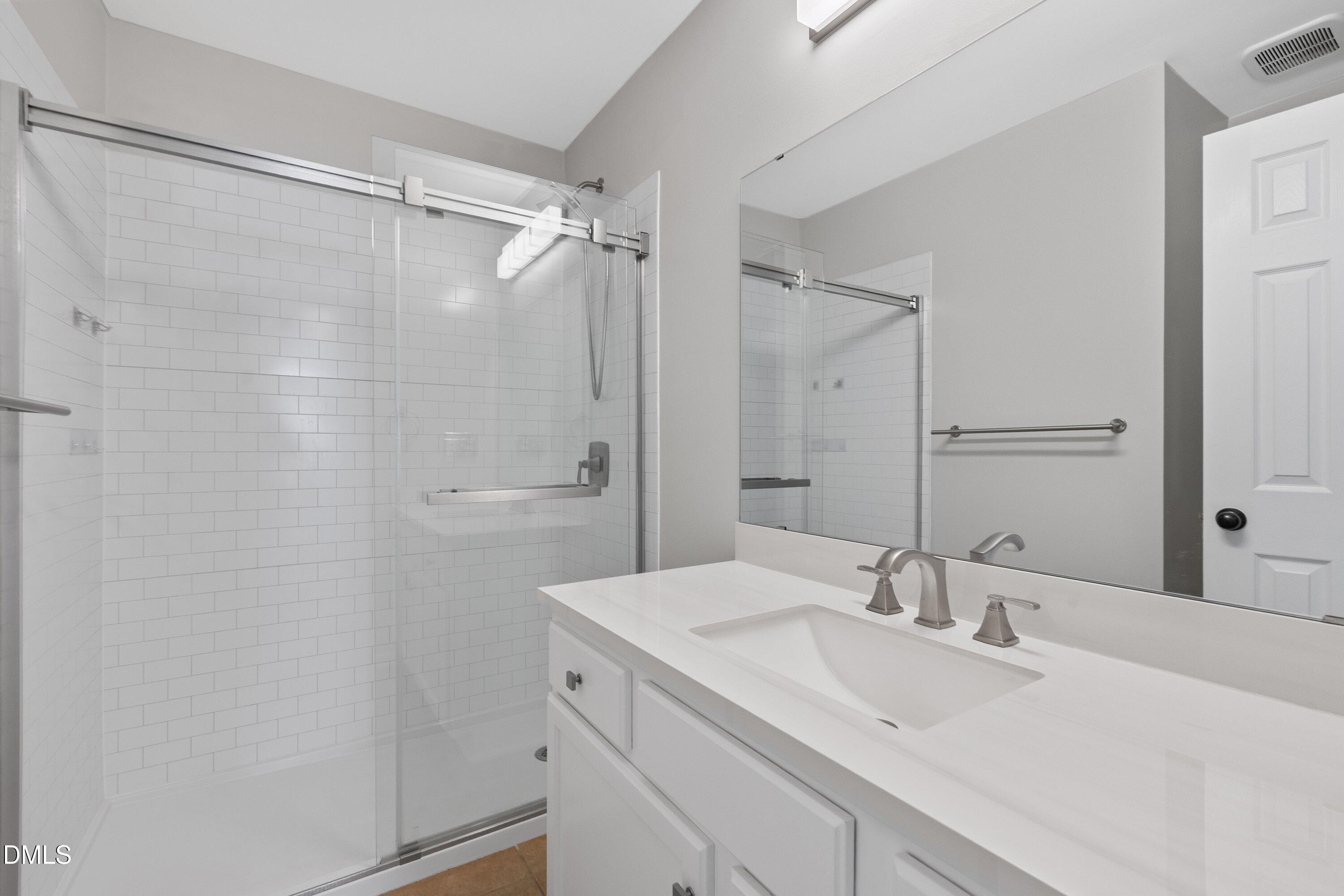 3717 Windmeade Road Wake Forest, NC 27587 - Photo 43 of 51 a bathroom with a sink and a mirror